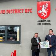 Vale of Clwyd MP Dr James Davies with Rhyl Rugby Club chairman Tony Evans.