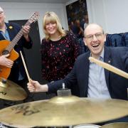 Llyr Gruffydd North Wales MS at Music Co-operative with head of service Heather Powell and chair, cllr Mark Young.
