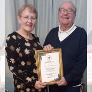 Stroma and John Williams with their certificate