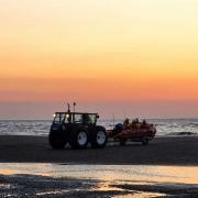 Sebastian Treloar took these photos of sunset while Rhyl lifeboat crew members carried out drills on the beach.