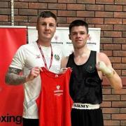 Joe Wright (right) with his boxing coach after being crowned a national champion