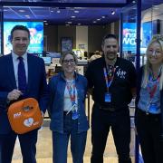 Dr James Davies MP (left) with the new defibrillator at the O2 store