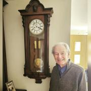 Walter Rigby with his fixed wall clock.