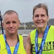 Warren Brown and Sarah Brooks moments after finishing the Conwy Half Marathon