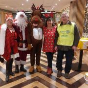 Santa, Rudolph and some of their Rotary helpers (Sharon Webster, Tracey Phillips and Chris Smith)