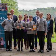 Headteacher Mark Hatch, independent Usborne partner Laura Rowlands,PC Dewi Owens, Phillipa Proctor, (CGI), Dave Evans, (PACT project manager) and Year 7 pupils at Ysgol Dinas Bran. Photo: Ethan Gilbert Media