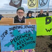 Campaigners pictures on Rhosneigr beach last year. (ImageNorth West Wales Climate Action Group)