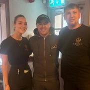 Alan Halsall with staff members Enya Jones and Will Gregory at The Crown Inn Trelawnyd