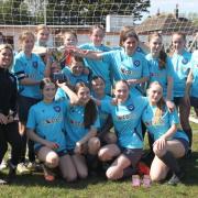 NFA's under-13 girls' team celebrate their cup success