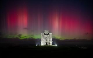 Aurora over Paxton's Tower in Carmarthen, Wales, September 25, 2023.
