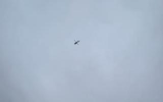 Helicopter circling over Kinmel Bay